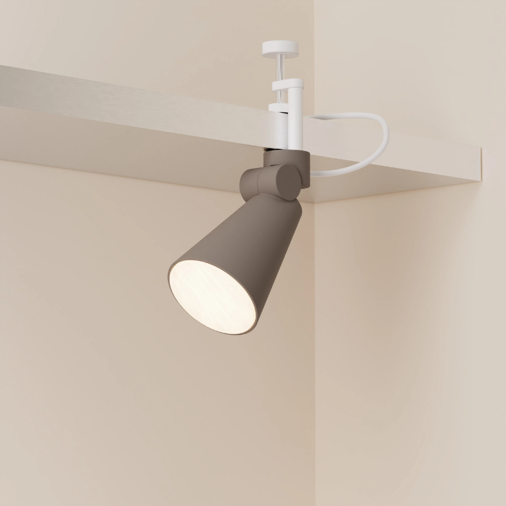 The smoke Aim Clamp Light from Gantri with the white clamp.