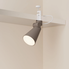 The smoke Aim Clamp Light from Gantri with the white clamp.