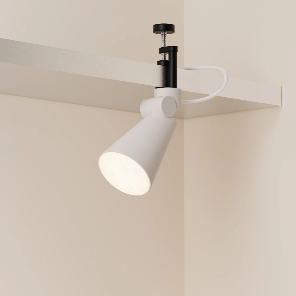 The stone Aim Clamp Light from Gantri with the black clamp.