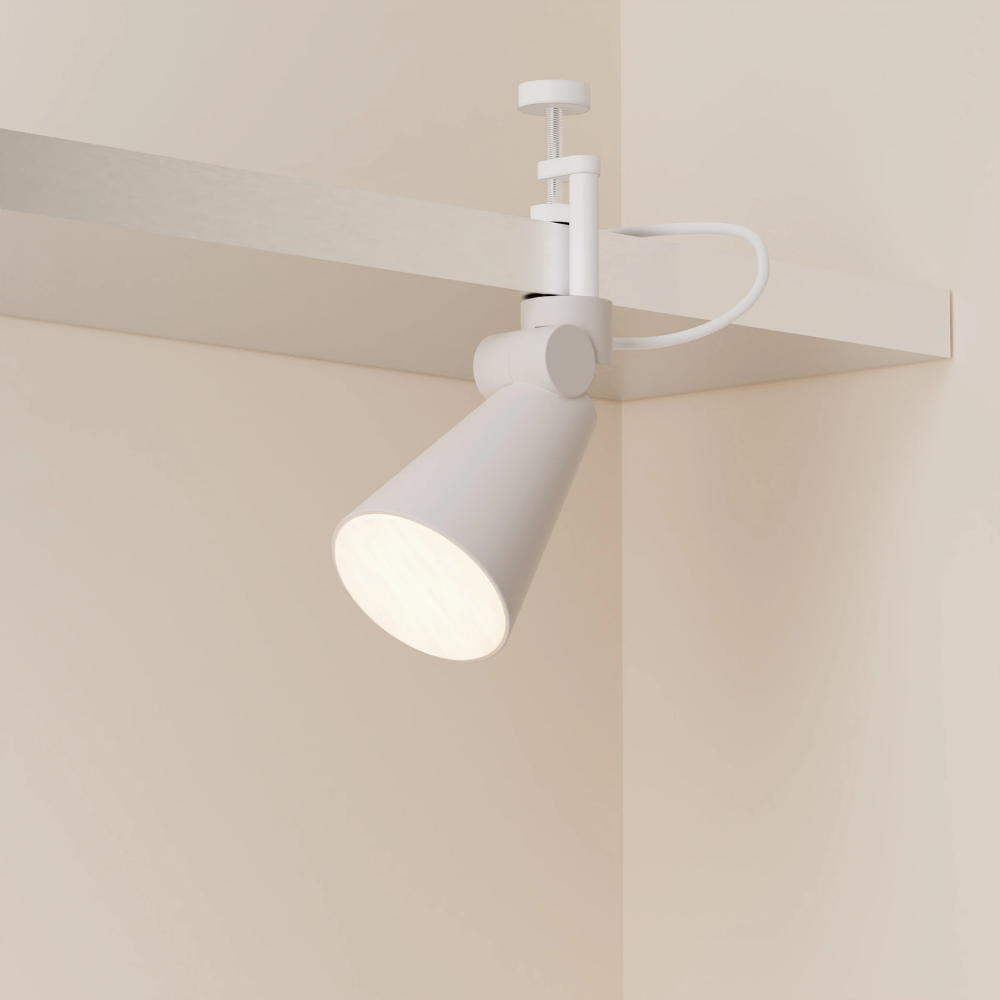 The stone Aim Clamp Light from Gantri with the white clamp.