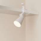 The stone Aim Clamp Light from Gantri with the white clamp.