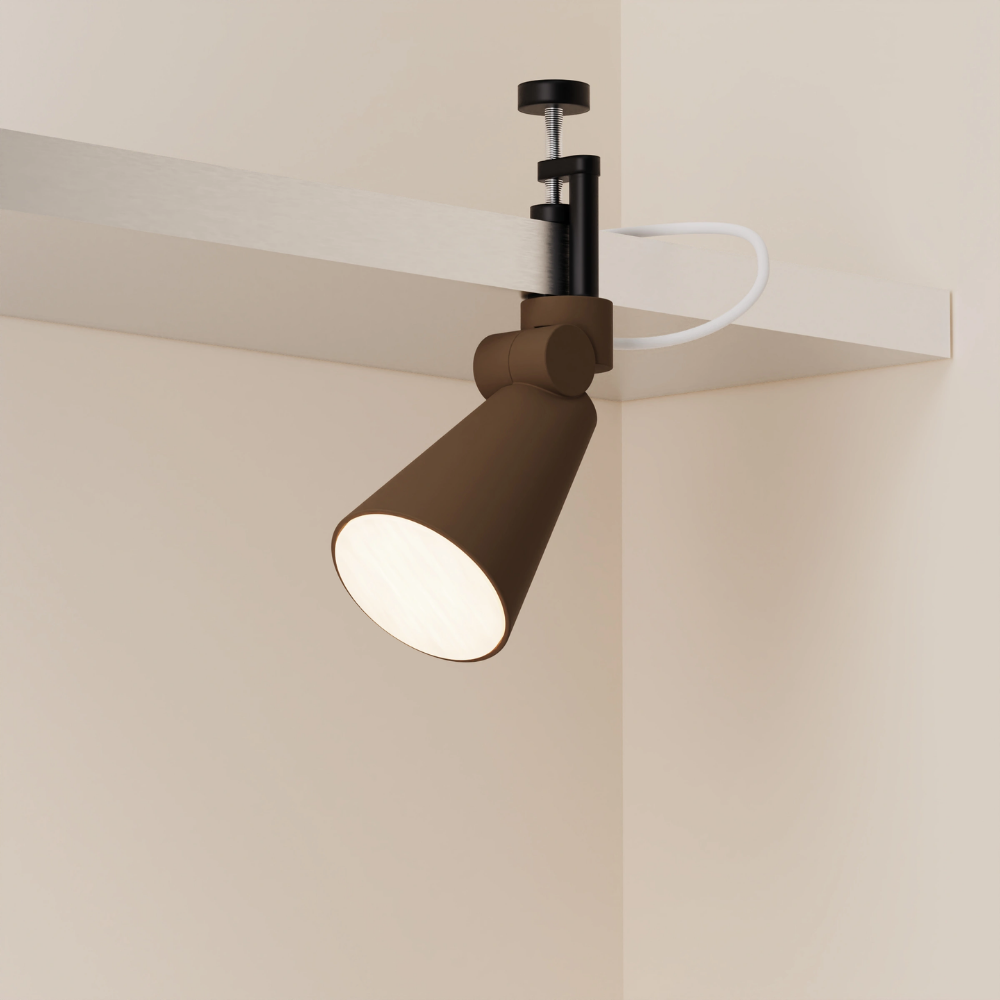 The walnut Aim Clamp Light from Gantri with the black clamp.