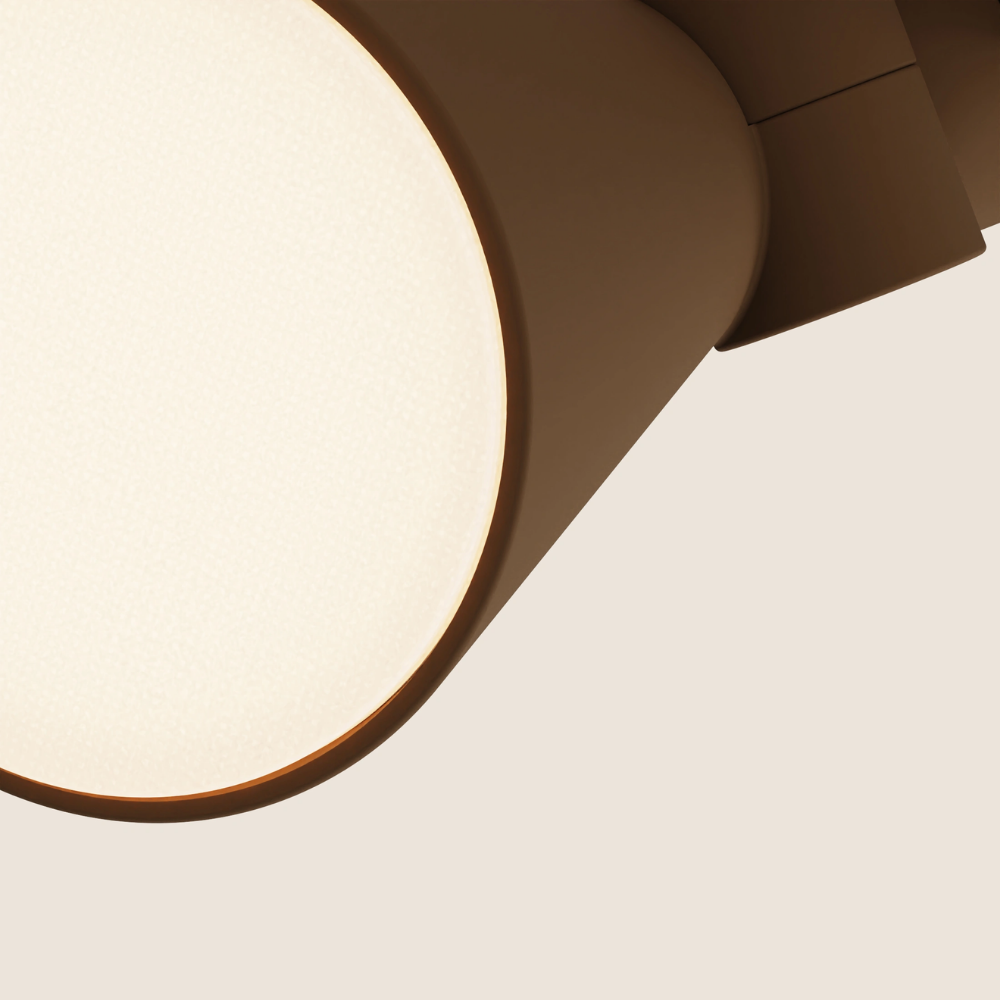 The walnut Aim Clamp Light from Gantri close up.
