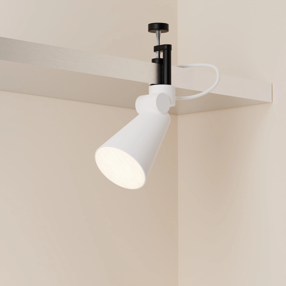 The snow Aim Clamp Light from Gantri with the black clamp.