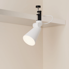 The snow Aim Clamp Light from Gantri with the black clamp.