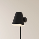 The carbon Aim Floor Light from Gantri with the black rod option.