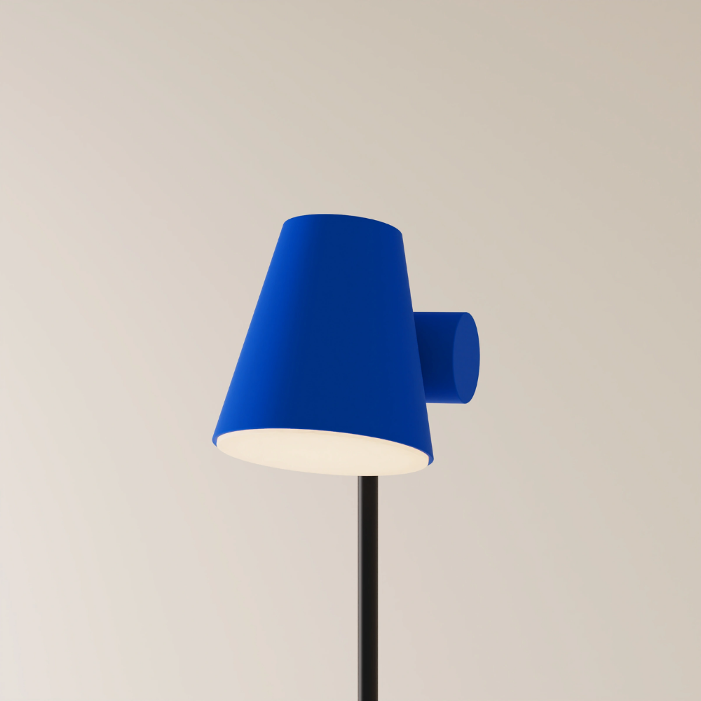 The cobalt Aim Floor Light from Gantri with the black rod option.