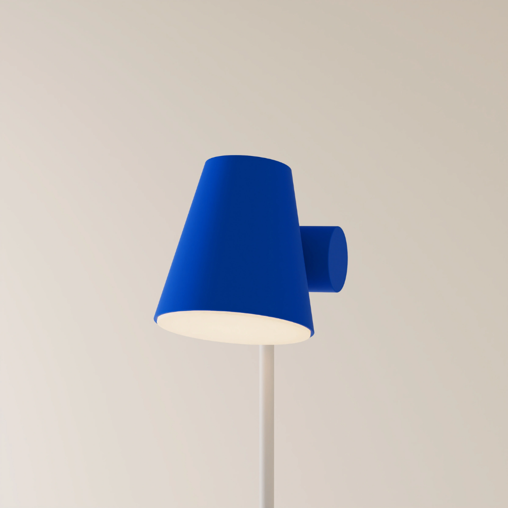 The cobalt Aim Floor Light from Gantri with the white rod option.