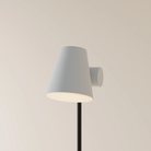 The mist Aim Floor Light from Gantri with the black rod option.