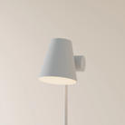 The mist Aim Floor Light from Gantri with the white rod option.