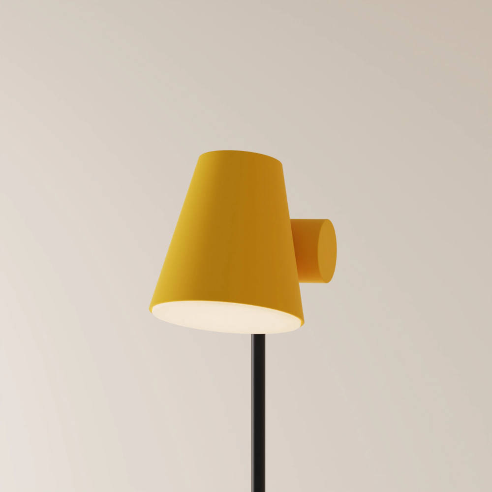 The mustard Aim Floor Light from Gantri with the black rod option.