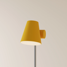 The mustard Aim Floor Light from Gantri with the chrome rod option.