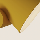 The mustard Aim Floor Light from Gantri close up.