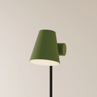 The olive Aim Floor Light from Gantri with the black rod option.