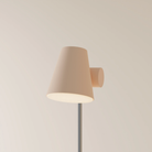 The peach Aim Floor Light from Gantri with the chrome rod option.