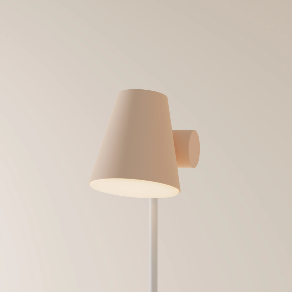 The peach Aim Floor Light from Gantri with the white rod option.