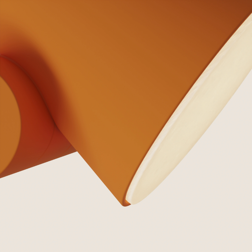 The persimmon Aim Floor Light from Gantri close up.