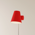 The poppy Aim Floor Light from Gantri with the white rod option.