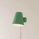 The sage Aim Floor Light from Gantri with the white rod option.