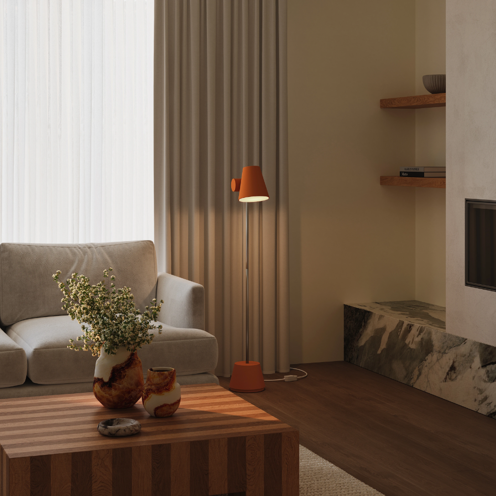 The sedona Aim Floor Light from Gantri with the chrome rod option in a  lounge space.