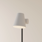 The stone Aim Floor Light from Gantri with the black rod option.