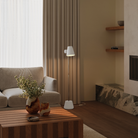 The stone Aim Floor Light from Gantri with the chrome rod option in a lounge space.