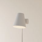 The stone Aim Floor Light from Gantri with the white rod option.