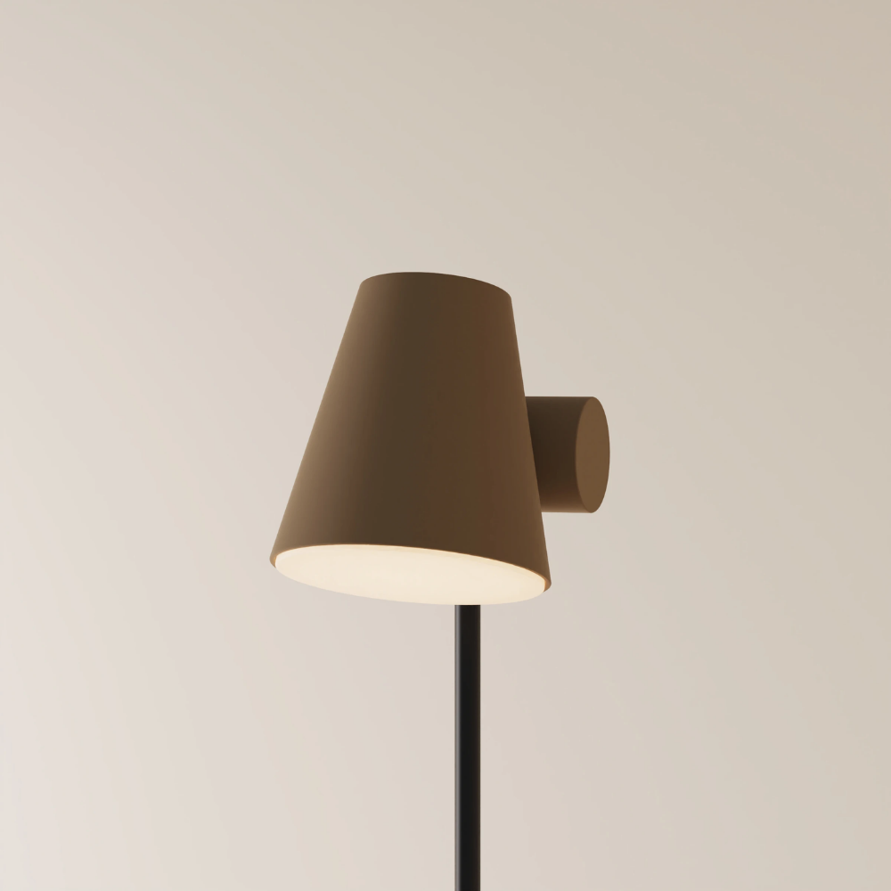 The walnut Aim Floor Light from Gantri with the black rod option.