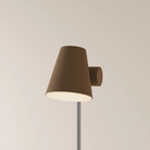 The walnut Aim Floor Light from Gantri with the chrome rod option.