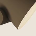 The walnut Aim Floor Light from Gantri close up.