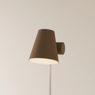 The walnut Aim Floor Light from Gantri with the white rod option.