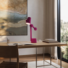 The hibiscus Aim Task Light from Gantri in a home office.