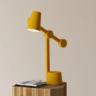 The mustard Aim Task Light from Gantri.