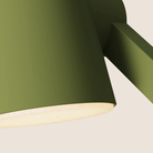 The olive Aim Task Light from Gantri close up.