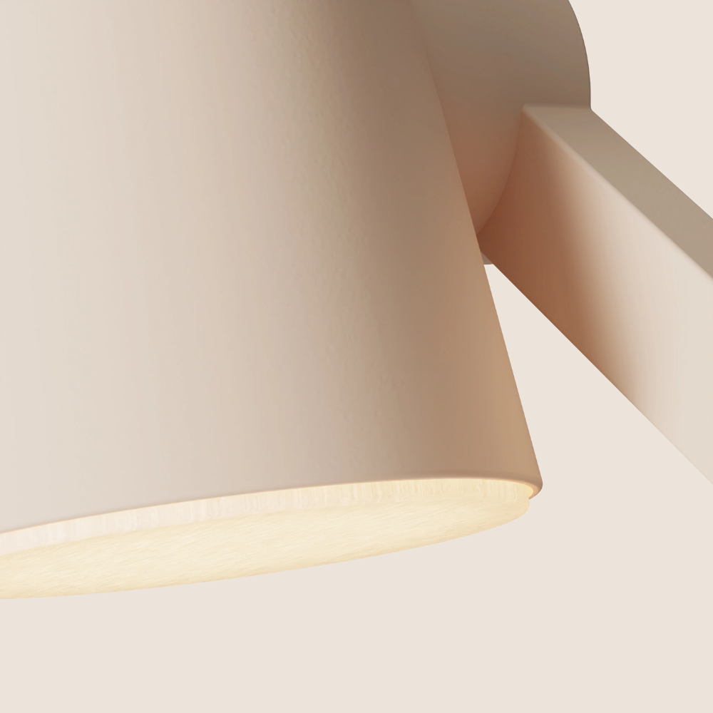 The peach Aim Task Light from Gantri close up.