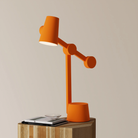 The persimmon Aim Task Light from Gantri.