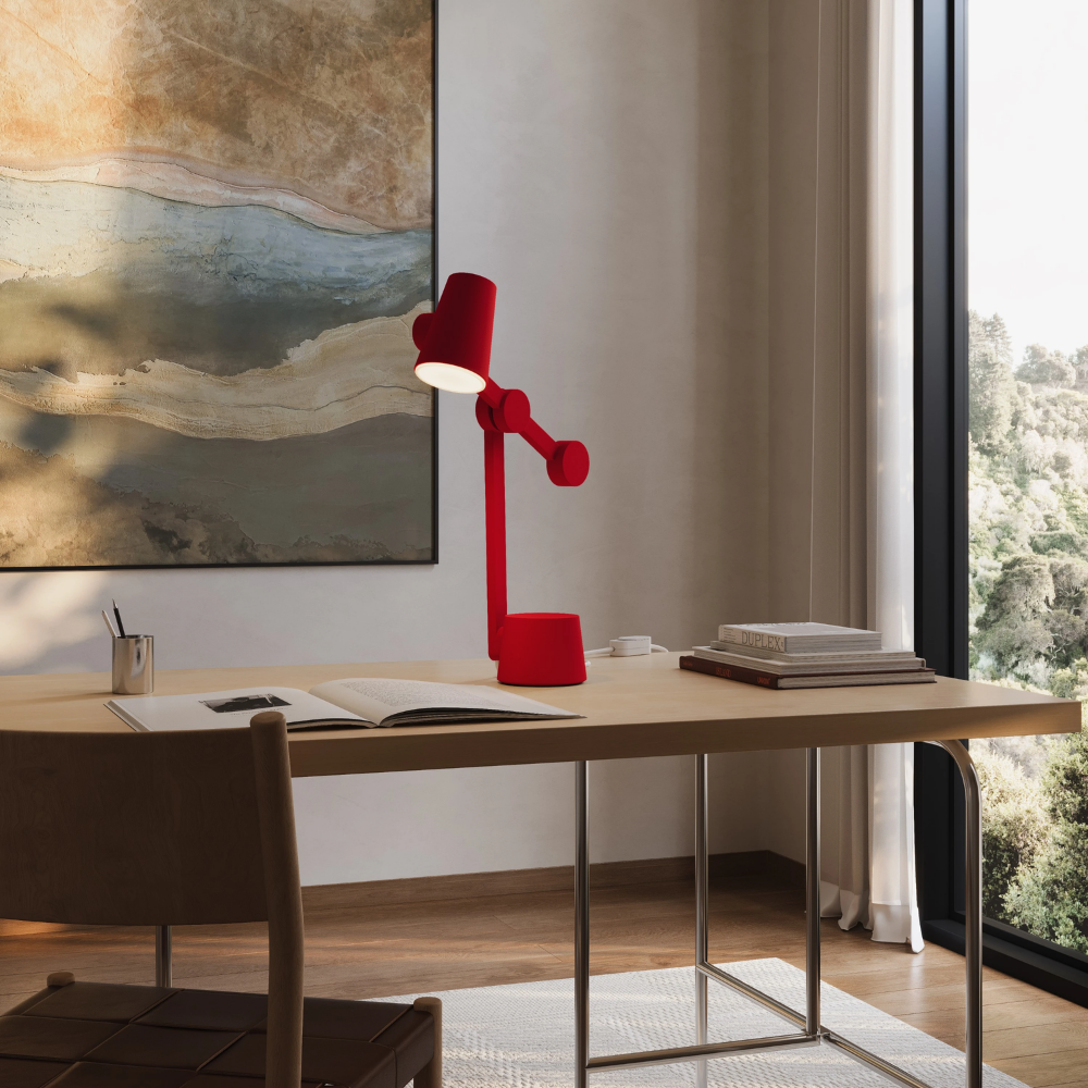 The poppy Aim Task Light from Gantri in a home office.