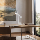 The snow Aim Task Light from Gantri in a home office.