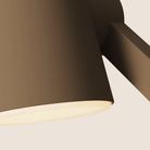 The walnut Aim Task Light from Gantri close up.