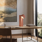 The blossom Analog Task Light from Gantri in a home office on top of a desk.