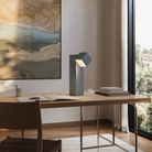 The fog Analog Task Light from Gantri in a home office on top of a desk.