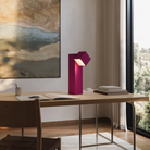 The hibiscus Analog Task Light from Gantri in a home office on top of a desk.