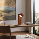 The sedona Analog Task Light from Gantri in a home office on top of a desk.