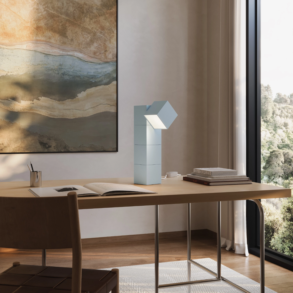 The sky Analog Task Light from Gantri in a home office on top of a desk.