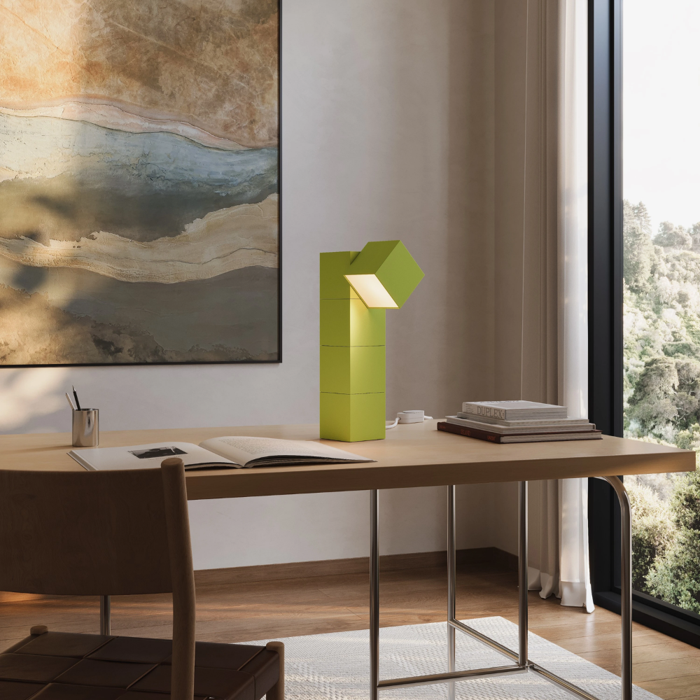 The sprout Analog Task Light from Gantri in a home office on top of a desk.