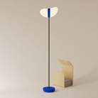 The cobalt Baltra Floor Light from Gantri with the black rod option.