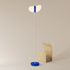 The cobalt Baltra Floor Light from Gantri with the white rod option.