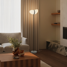 The mist Baltra Floor Light from Gantri with the black rod option in a living room.