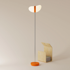 The persimmon Baltra Floor Light from Gantri with the chrome rod option.