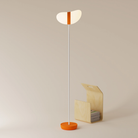 The persimmon Baltra Floor Light from Gantri with the white rod option.